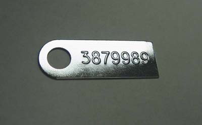 1965 Chevrolet El Camino MANUAL TRANSMISSION TAG (3879989) - FOR L78 EQUIPPED WITH AN M-22.  THE PART NUMBER IS STAMPED FROM THE BACKSIDE; THE RAISED ID NUMBER ON THE FRONT READS 3879989 | MT5239Z