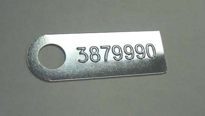1965 Chevrolet El Camino MANUAL TRANSMISSION TAG (3879990) - FOR L78 4.10 W/G80 EQUIPPED WITH AN M-22.  THE PART NUMBER IS STAMPED FROM THE BACKSIDE; THE RAISED ID NUMBER ON THE FRONT READS 3879990 | MT5619Z