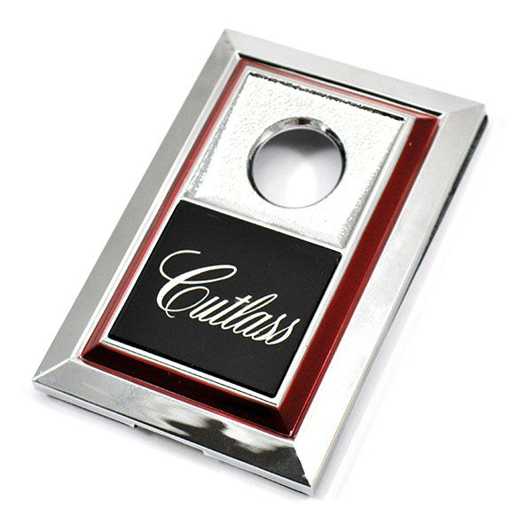 1984 Oldsmobile Cutlass/442/F85 TRUNK LOCK BEZEL EMBLEM (CUTLASS) - EA | EM1806T